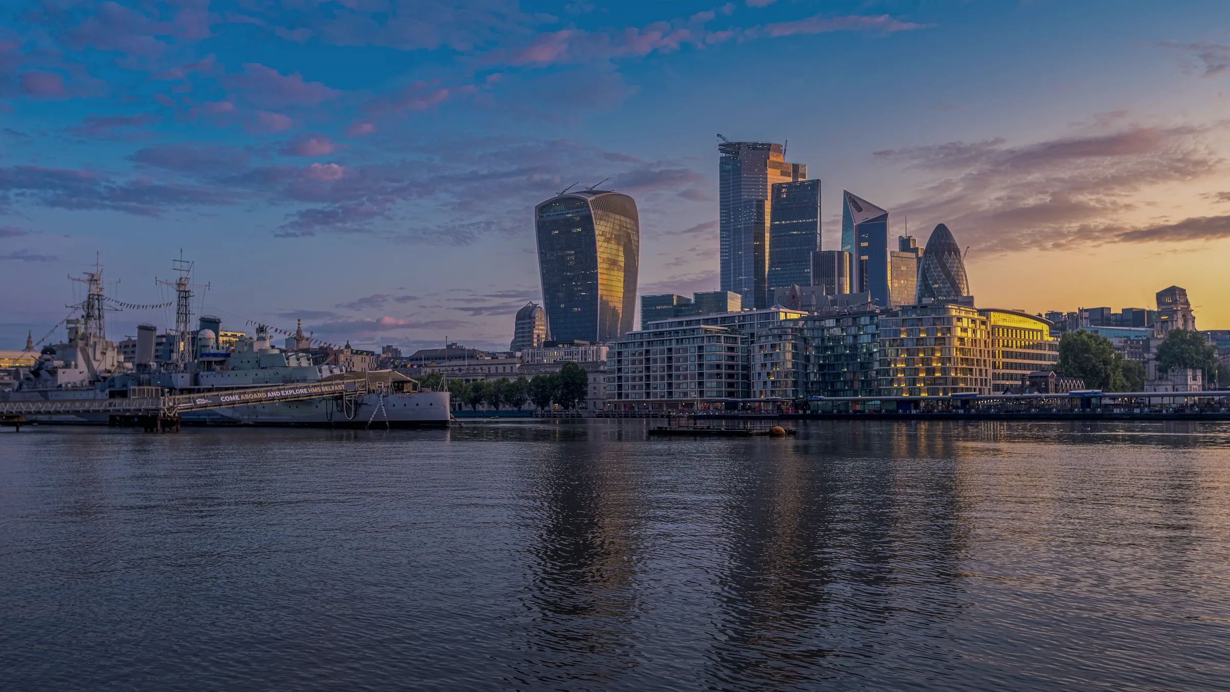 The City of London at dusk, seen across the Thames